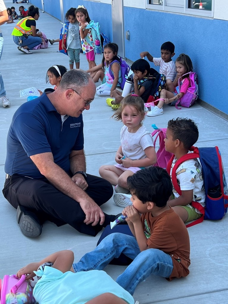 Dana Eaton sitting with children